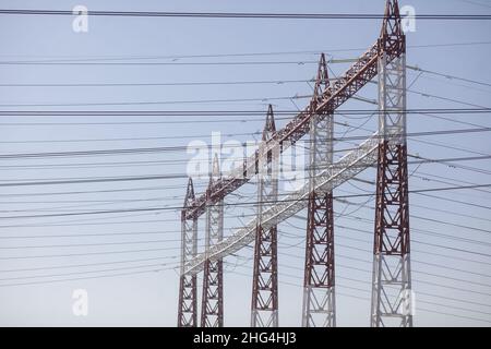 High voltage transmission lines on metallic poles in Bucharest, Romania. Stock Photo
