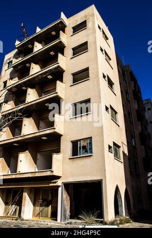 Varosha, Northern Cyprus - January 06, 2022 Cityscape of Varosha, a seaside resort built in 1972, which became a ghost town abandoned by its inhabitan Stock Photo