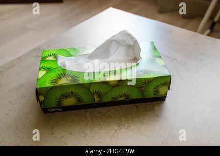Opened tissue box on grey table background Stock Photo