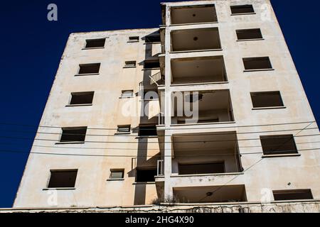 Varosha, Northern Cyprus - January 06, 2022 Cityscape of Varosha, a seaside resort built in 1972, which became a ghost town abandoned by its inhabitan Stock Photo