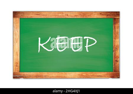 KEEP text written on green wooden frame school blackboard. Stock Photo