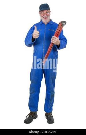 Craftsmen are great. Old experienced plumber with his red pipe wrench shows the thumb up. Stock Photo