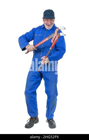 An old, funny plumber is having fun with his big red pipe wrench. Stock Photo