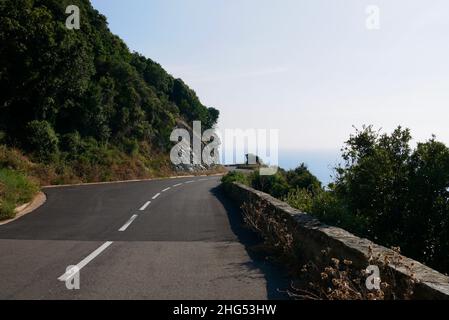 Scenic road winding through coast of Cap Corse. Corsica, France. High quality photo Stock Photo