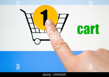 Time-Lapse: Shopping in a online shop - cart .The images on the screen are produced by me Stock Photo