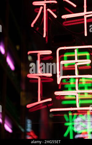 Colorful neon sign for asian cafe or chinese restaurant. Interior design with asian illumination Stock Photo