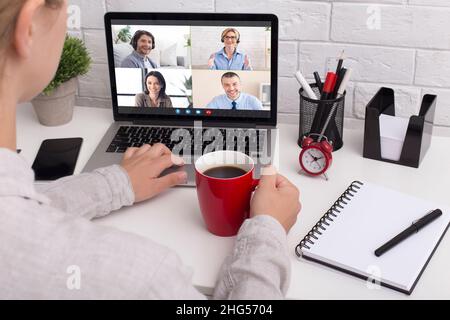 Remote Meeting. Unrecognizable Female Entrepreneur Having Video Conference With Collagues Stock Photo