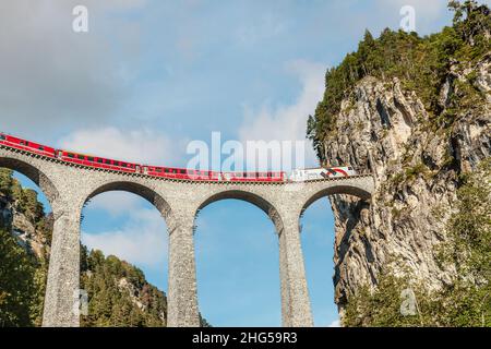 Express train at the Landwasser Viaduct in the Swiss Alps, Switzerland Stock Photo