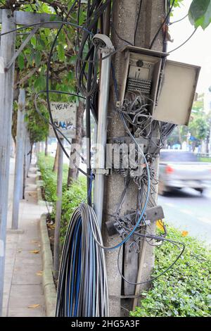 Abandon and broken electrical cable box cabinet on power line pole. Stock Photo