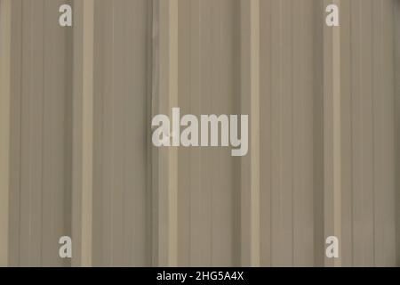 dents on brown corrugated metal sheet texture background Stock Photo