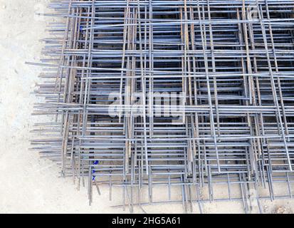 steel rod or rebar with some rust bonded with steel wire for use as a construction infrastructure, steel beams at the factory Stock Photo