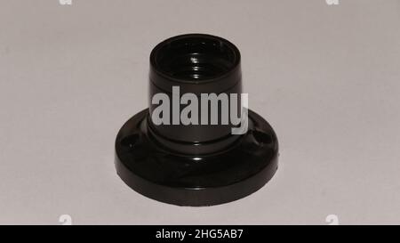 Black ceiling lamp holder isolated on light gray background Stock Photo