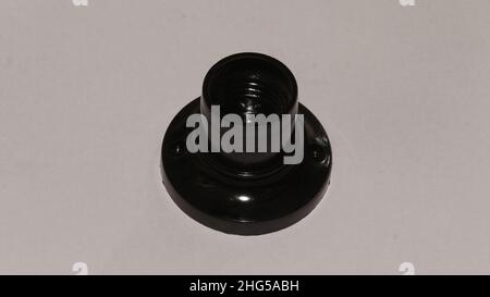 Black ceiling lamp holder isolated on light gray background Stock Photo