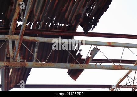 Old Galvanized Iron, Grunge rusted metal texture, rust and oxidized metal background. decayed metal iron panel with rusty metal roof. Stock Photo