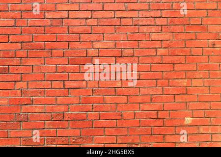 red shiny brick wall, wide panorama of masonry, bricklaying Stock Photo