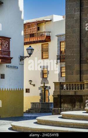 Old Las Palmas Vegueta street scene in late afternoon sun, with Cathedral Santa Ana in foreground with entrance steps Vegueta Las Palmas de Gran Canaria Spain Stock Photo