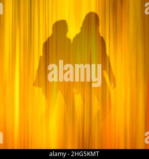 Conceptual image of two people walking. Their identity, gender and relationship is ambiguous. Stock Photo