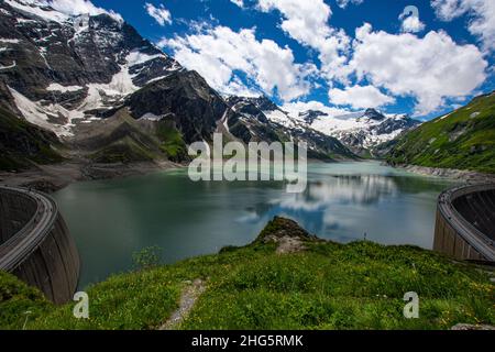 View of the Stausee Mooserboden glacier dam, which rises below the Kaprun glacier and is one of the largest producers of electricity in Austria. Relax Stock Photo