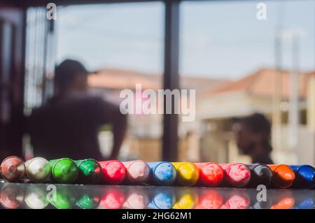 Focused crayon color diversity and hand picking up a brown crayon ,copy space Stock Photo