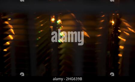 Close up of infrared heaters in the dark boiler room. Metal construction at the plant under the blinking yellow light. Stock Photo