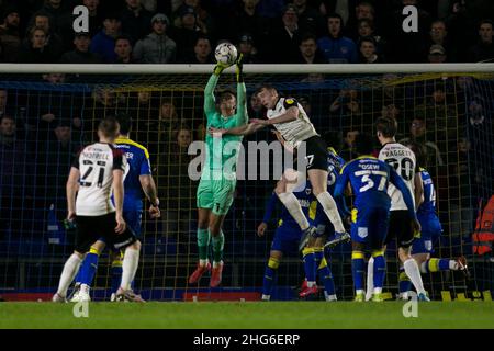 WIMBLEDON, UK. JAN 18TH Nik Tzanev of AFC Wimbledon and Hayden Carter of Portsmouth battle for the ball during the Sky Bet League 1 match between AFC Wimbledon and Portsmouth at Plough Lane, Wimbledon on Tuesday 18th January 2022. (Credit: Federico Maranesi | MI News) Credit: MI News & Sport /Alamy Live News Stock Photo
