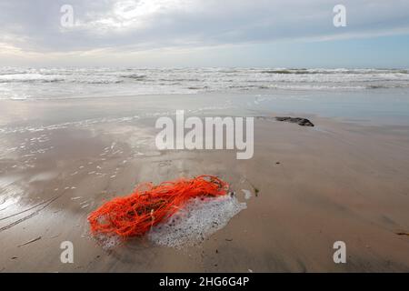 fishing net stranded on beach near Lonstrup, Denmark Stock Photo