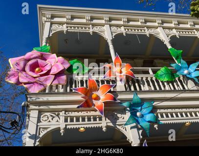 NEW ORLEANS, LA, USA - JANUARY 14, 2022: Old home decorated with large flower petals for Mardi Gras Stock Photo