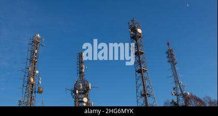 Pylons with telecommunication repeaters Stock Photo