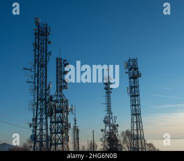 Pylons with telecommunication repeaters Stock Photo