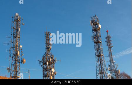 Pylons with telecommunication repeaters Stock Photo
