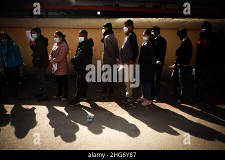 Kathmandu, Bagmati, Nepal. 18th Jan, 2022. People stand in line waiting for their turn to get inoculated with COVID-19 vaccines at Teku Hospital in Kathmandu. The Nepal government makes vaccination cards mandatory to attend public services or to be at public events and locations starting from 21st January. (Credit Image: © Amit Machamasi/ZUMA Press Wire) Stock Photo