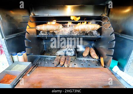 Kokoretsi or kokoreç is a dish of the Balkans and Anatolia consisting mainly of lamb or goat intestines grilled on a split. Stock Photo