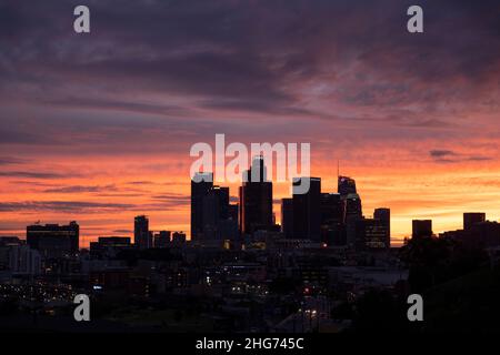 Silhouette of the downtown Los Angeles skyline with a colorful fading sunset backdrop Stock Photo