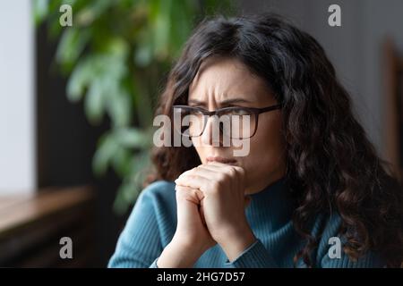 Nervous anxious business woman wait for job interview or exam result, try to solve problem at work Stock Photo