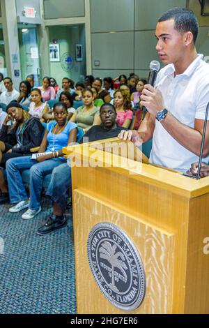 Miami Florida,City Hall,Commission Chambers,Mock City Commission Meeting,students role playing budget hearing,Hispanic teen teenager speaking podium Stock Photo