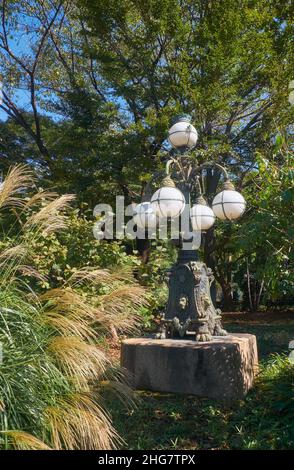 The view of decorative electric lantern at Art Nouveau style from the late 1880s in the Imperial Palace garden. Tokyo. Japan Stock Photo