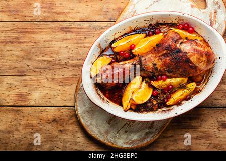 Turkey meat baked in oranges. Roasted turkey leg, space for text Stock Photo