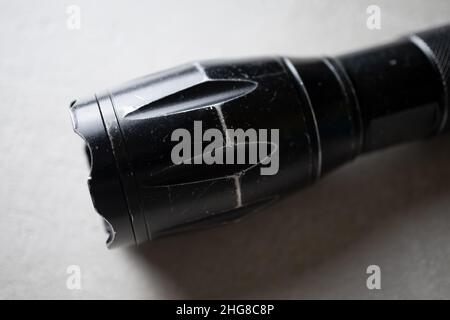 used flashlight shocker on a light background close-up, the concept of protection and security Stock Photo