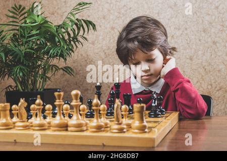Boy Concentrating on His Next Chess Move Stock Image - Image of  concentration, glass: 295057