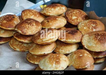 appam,a kerala cuisine made of rice and coconut milk,served with green ...