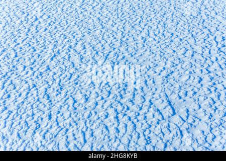Texture of the snow, white blue pattern of the snow, cold day, natural winter pattern after snowstorm Stock Photo