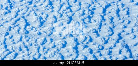 Texture of the snow, white blue pattern of the snow, cold day, natural winter pattern after snowstorm Stock Photo
