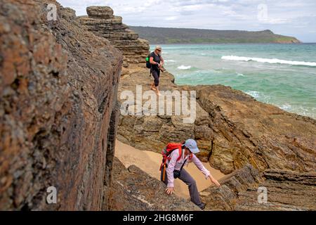 Walkers on Moorina Bay on the Cape Queen Elizabeth track Stock Photo