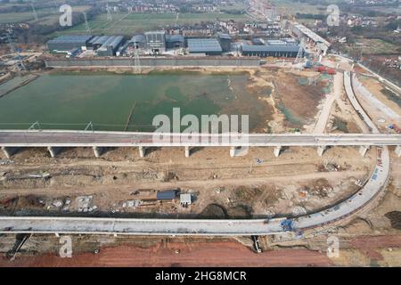 Hangzhou, Hangzhou, China. 19th Jan, 2022. On January 19, 2022, the Hu hang railway, which has been completely laid and connected, was viewed from the air. Recently, as a key supporting project for the 2022 Hangzhou Asian Games, the whole line of the Hangzhou Hangzhou railway has been laid and connected, laying a solid foundation for its completion and opening before the Hangzhou Asian Games.As the first high-speed railway under construction in Zhejiang Province, Huzhou Hangzhou railway passes through South Taihu new area, Wuxing district and Deqing County of Huzhou City, Yuhang District Stock Photo