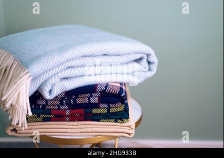 Stack of woolen checked blankets Stock Photo
