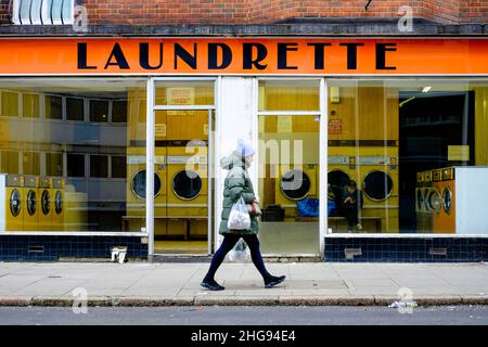 Public coin operated laundrette, central London, United Kingdom. Stock Photo