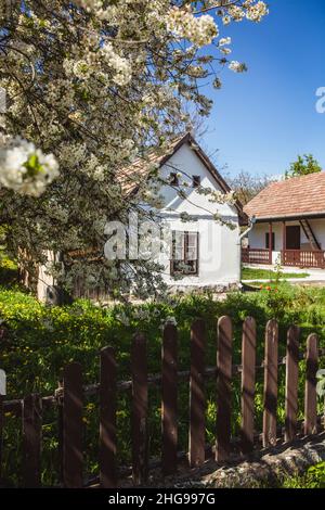 HOLLOKO, HUNGARY - April 12, 2019: Traditional houses in village Holloko in Hungary. The village is included in the UNESCO list of cultural values Stock Photo