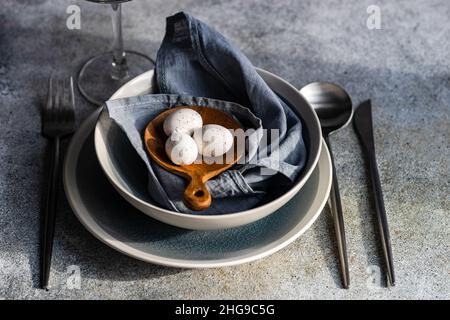 Overhead view of a festive place setting with Easter eggs Stock Photo