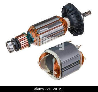 Electric DC motor stator and rotor with plastic fan. Engine parts with steel sheet, copper commutator, wire winding or metal ball bearing. Electronics. Stock Photo