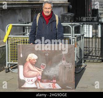 London UK 19 January 2022 Artist Kaya Mar outside Downing Street with his latest  painting of Boris Johnson, 'Who are you Kidding Boris”.Paul Quezada-Neiman/Alamy Live News Stock Photo